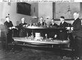 Rear Admiral David W. Taylor (left), Chief of the Bureau of Construction and Repair, and Rear Admiral John K. Robison (right), Chief of the Bureau of Engineering, hold a model of the battlecruiser above a model of the proposed conversion to an aircraft carrier at the Navy Department on 8 March 1922.