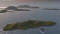 Katori uses its' high gun arcs to fire over an island and hit an enemy Langley class aircraft carrier.