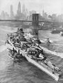 Richelieu arrives in New York with her damaged turret. The uppermost fire control director on the fore tower had to be dismantled for her to pass under the Brooklyn Bridge to the New York Navy Yard.