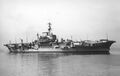 Profile view of Implacable at anchor