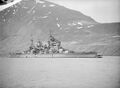 King George V, photographed here with a huge hole in her bows, after she collided with HMS Punjabi in dense fog on 1 May 1942, at Seydisfjord, Iceland.