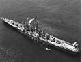 USS Cleveland with crew paraded on deck for Captain's inspection, 28 March 1944.