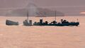 A Minekaze fails to dodge a torpedo spread.