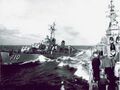 Gearing alongside USS Newport News during UNREP (underway replenishment) in the Mediterranean Sea, circa 1951.