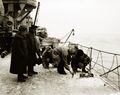 HMS Caledon's crew scraping ice off, December 1918.