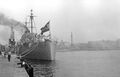 Canarias docked at Barcelona. Columbus Monument, Barcelona can be seen behind the ship.
