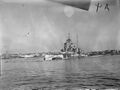 HMS Queen Elizabeth in Alexandria harbour surrounded by anti-torpedo nets.