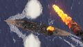 Tirpitz is hit by a bomb as she downs an enemy aircraft.
