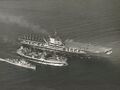 U.S. Navy fleet oiler USS Chukawan (AO-100) refueling Midway and the Sumner-class destroyer USS John R. Pierce (DD-753) in 1950.