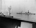 A heavy German coast artillery shell falls between Texas, in the background, and USS Arkansas, while the two battleships were engaging Battery Hamburg during the bombardment of Cherbourg, France, 25 June 1944.