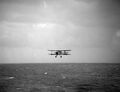 A Swordfish returns to HMS Ark Royal after making a torpedo attack against Bismarck.