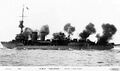 Caledon-class light cruiser HMS Calypso laying down a smoke screen.