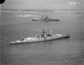 Future enemies at peace. Hood (background), Resolution (center), and the German pocket battleship Admiral Graf Spee (foreground), anchored at Portsmouth for King George VI's Coronation, May 1937.