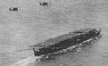 Ryūjō during the 1930s with a pair of Aichi D1A2 dive bombers overhead.